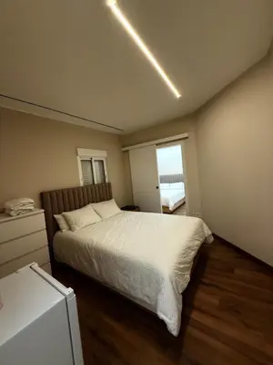 a bedroom with a large bed and a window at Beautiful duplex apartment in center Barcelona in Barcelona
