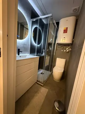 a bathroom with a shower and a sink and a toilet at Beautiful duplex apartment in center Barcelona in Barcelona