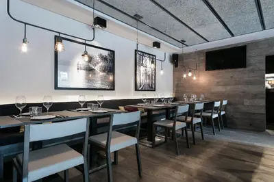 a dining room with a long table and chairs at Upper Diagonal in Barcelona