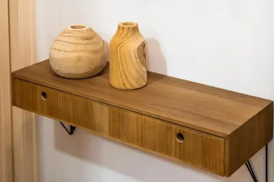 two vases are sitting on a wooden shelf at Whisper-Quiet 2BR Near Sagrada in Barcelona