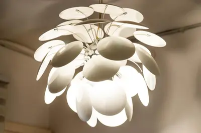 a white chandelier hanging from a ceiling at Whisper-Quiet 2BR Near Sagrada in Barcelona