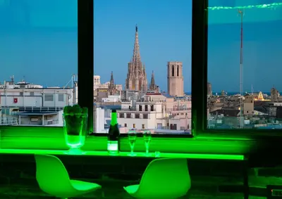 a green bar with a view of a city at Enjoybcn Plaza Catalunya Apt. in Barcelona