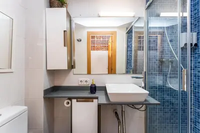 a kitchen with a washer and dryer and a door at Mediterranean and connected in Sant Adria de Besos