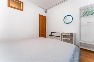 a bedroom with a bed with two blue night stands at Mediterranean and connected in Sant Adria de Besos