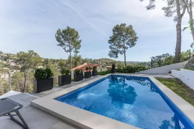 a swimming pool in the backyard of a house at Casa Olivella #7 by Happy Houses Barcelona in Olivella