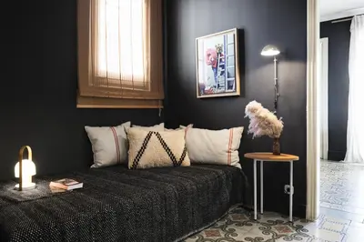 a living room with a couch and a table at Brummell Apartments Gracia in Barcelona