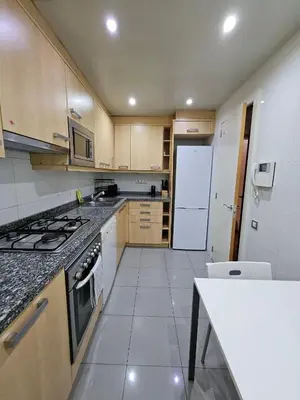 two beds sitting next to each other in a room at Ramblas flat 3Bedroom and Pool Min 32 days in Barcelona