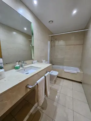 a living room with a table and chairs and a couch at Ramblas flat 3Bedroom and Pool Min 32 days in Barcelona