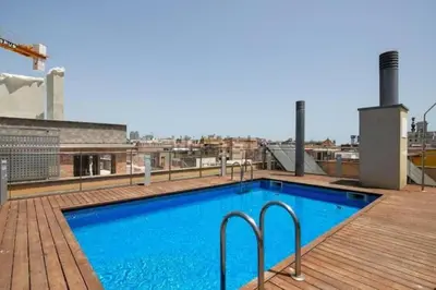 a swimming pool on the roof of a building at Ramblas flat 3Bedroom and Pool Min 32 days in Barcelona