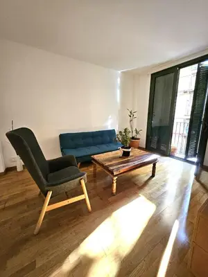 a kitchen with a stove and a white refrigerator at Ramblas flat 3Bedroom and Pool Min 32 days in Barcelona