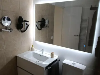 a bathroom with a sink and a mirror at Can Masia in Olivella