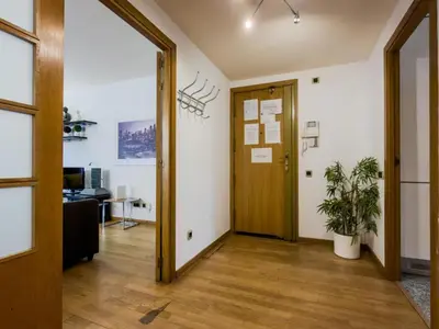 an office hallway with a door and a potted plant at Bed BCN Vila Olímpica. in Barcelona