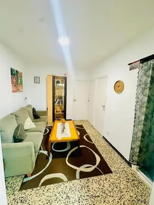 a living room with a couch and a table at heart of collblanc in Hospitalet de Llobregat
