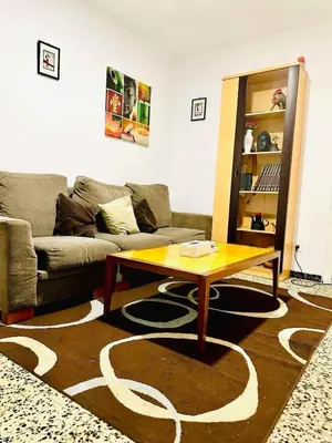 a living room with a couch and a coffee table at heart of collblanc in Hospitalet de Llobregat