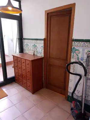 a room with a desk and a door at Charming traditional family townhouse in Calella in Calella