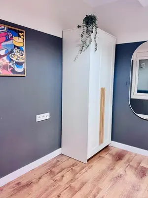 an empty room with a white door and a painting at Apartamento Lauda 2 in Hospitalet de Llobregat