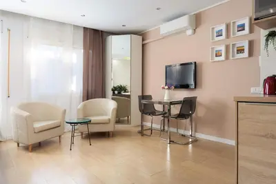a large bathroom with a tub and a kitchen at Perfect Romantic Getaway Cozy Retreat with Jacuzzi in Barcelona