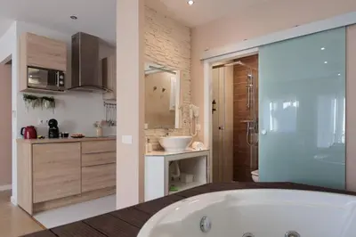 a bathroom with a bath tub and a sink at Perfect Romantic Getaway Cozy Retreat with Jacuzzi in Barcelona