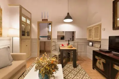 a living room with a couch and a table at Romantic in Trendy Gracia in Barcelona