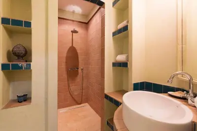 a bathroom with a sink and a shower at Romantic in Trendy Gracia in Barcelona