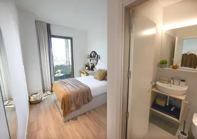 a bathroom with a toilet and a sink and a shower at aparto Diagonal Suites in Esplugues de Llobregat