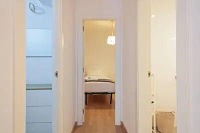 a hallway with a bed in a room at Dialez Holidays - Colomeres in Gavà
