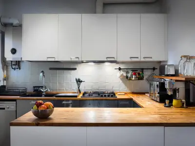 a kitchen with a bowl of fruit on a counter at Cosy Sants Apartment in Barcelona