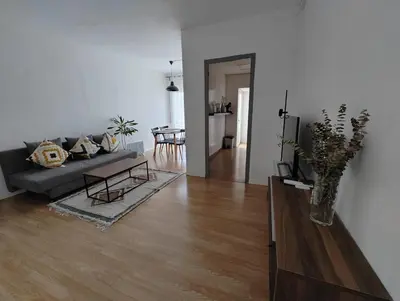 a living room with a couch and a table at Apartamento en Montgat - Serenity Stays in Montgat