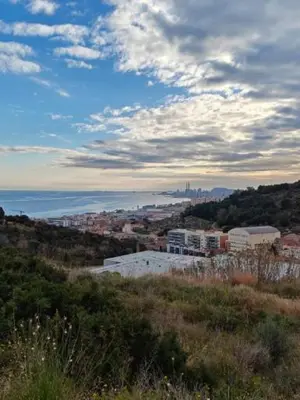 a view of a city from a hill with the ocean at Apartamento en Montgat - Serenity Stays in Montgat