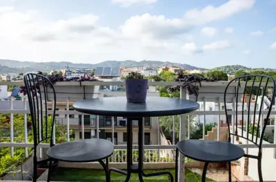 a table and chairs on a balcony with a view at Apartamento en Montgat - Serenity Stays in Montgat