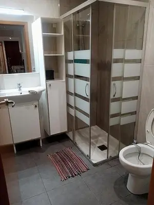 a bedroom with a bed and a dresser with a mirror at Bon Casa en Bon Pastor in Barcelona