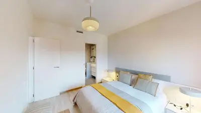 a bedroom with a large bed in a room at Impressive apartment for 6 in Gracia in Barcelona