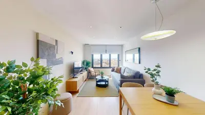 a living room with a couch and some plants at Impressive apartment for 6 in Gracia in Barcelona