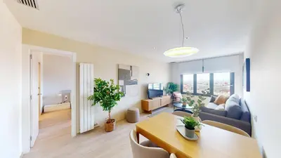 a living room with a table and a couch at Impressive apartment for 6 in Gracia in Barcelona