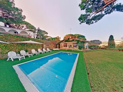 a swimming pool in the yard of a house at Premium Habitat Les Villes in Arenys de Mar