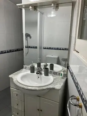 a bathroom with a sink and a mirror at Casa EMILIO in Olesa de Montserrat