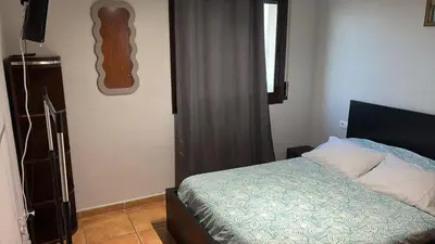 a small bedroom with a bed and a window at Calle Ramon Berenguer Iv, 13, Sant Pere de Ribes barcelona 08812 in Vilanova i la Geltrú