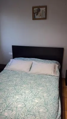 a bedroom with a bed with a black head board at Calle Ramon Berenguer Iv, 13, Sant Pere de Ribes barcelona 08812 in Vilanova i la Geltrú