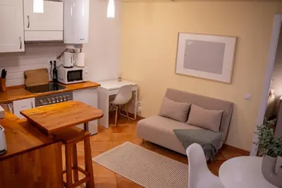 a small living room with a couch and a kitchen at Apartment in Ciutat Vella Born in Barcelona