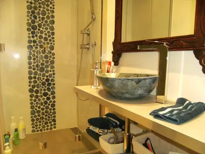 a bathroom with a bowl sink and a shower at Blanca Subur in Sitges