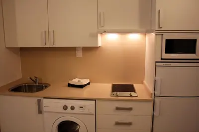 a kitchen with a sink and a washing machine at 3-Apartament full equiped, next to Mobile Congres in Hospitalet de Llobregat