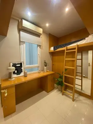 a room with a desk and a bunk bed at Centric Apartment with Balcony in Barcelona