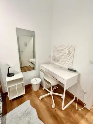 a shower with a glass door next to a sink at Habitación 2 Ronda Sant Pau in Barcelona