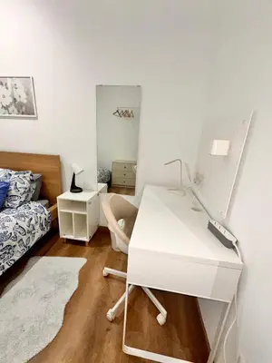 a kitchen with a washing machine in a white kitchen at Habitación 2 Ronda Sant Pau in Barcelona