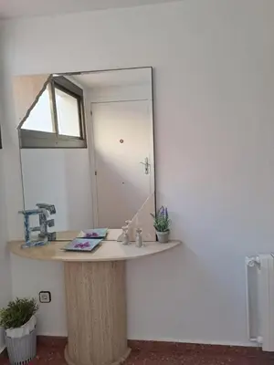 a bathroom with a sink and a mirror on a counter at Voramar, Apartamento a primera línea de mar y con piscina in Canet de Mar