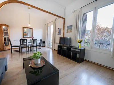 a living room with a couch and a tv at Apartment amazing Sagrada familia view I in Barcelona