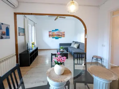 a living room with a table and a couch at Apartment amazing Sagrada familia view I in Barcelona