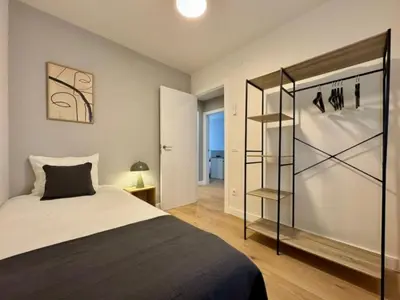 a bedroom with a bed and a book shelf at Brand new apartment with views in Barcelona in Barcelona
