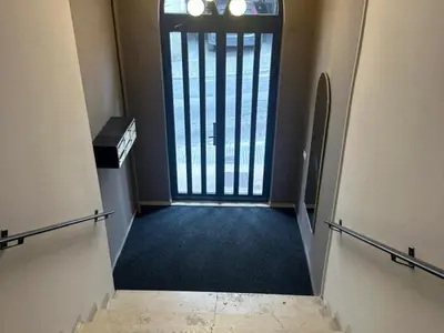 an empty hallway with a door to a room with a window at Brand new apartment with views in Barcelona in Barcelona