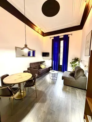 a living room with a table and a couch at Hotelito Luxe in Barcelona